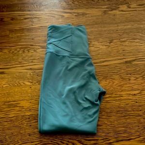 blue leggings with design on bottom of pants and waistband